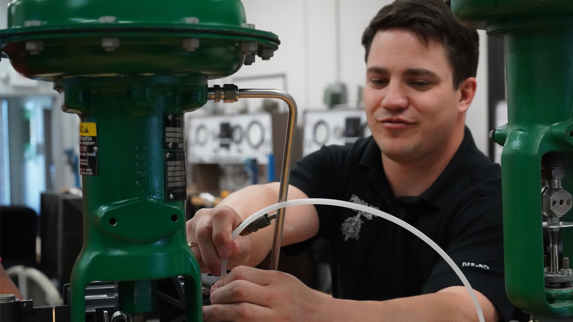 instructor in mechatronics lab with machine