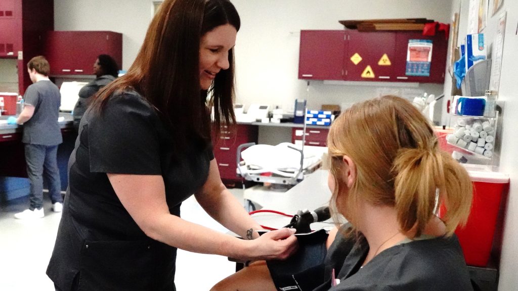 student taking blood pressure